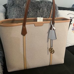 Tory Burch. Perry Canvas; triple compartment.